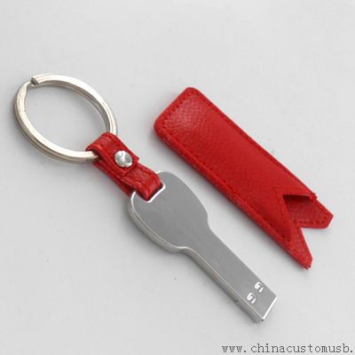 Clave en forma de sticks de memoria USB con funda de cuero